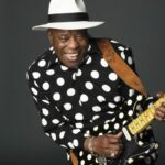 photo of Buddy Guy dressed in polka dots and matching guitar