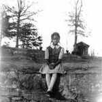 8 yr old Nina Simone 1941 sitting on stone wall