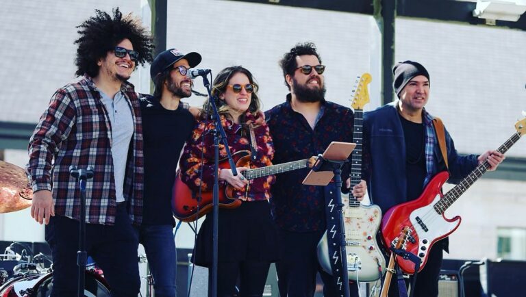 Lead singer and SLP founder Lisset Diaz (center) with bassist Alejandro Gonzalez (bottom left), lead guitarist and co-founder Miguel Comas (top left), keyboardist Wilfredo Gatell (top right), and drummer Angel Luis Millet (bottom right). Photo courtesy of Sweet Lizzy Project