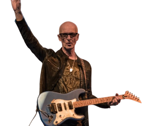 Kim Mitchell waving to audience
Live Performance: Kim Mitchell