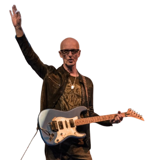 Kim Mitchell waving to audience
Live Performance: Kim Mitchell