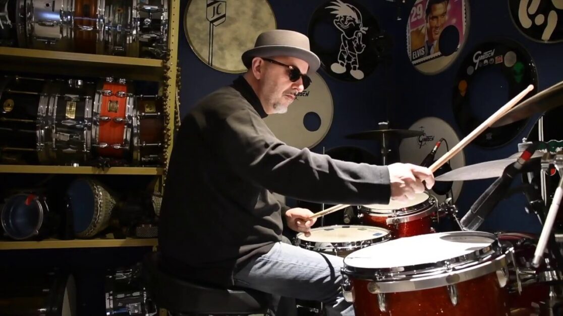 Jim Casson in home studio playing drums